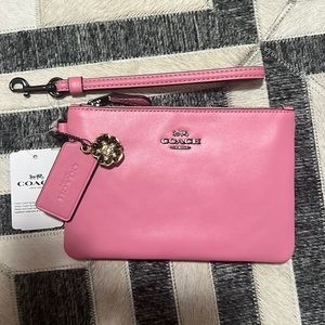 New coach wristlet with flower charm. Pink!